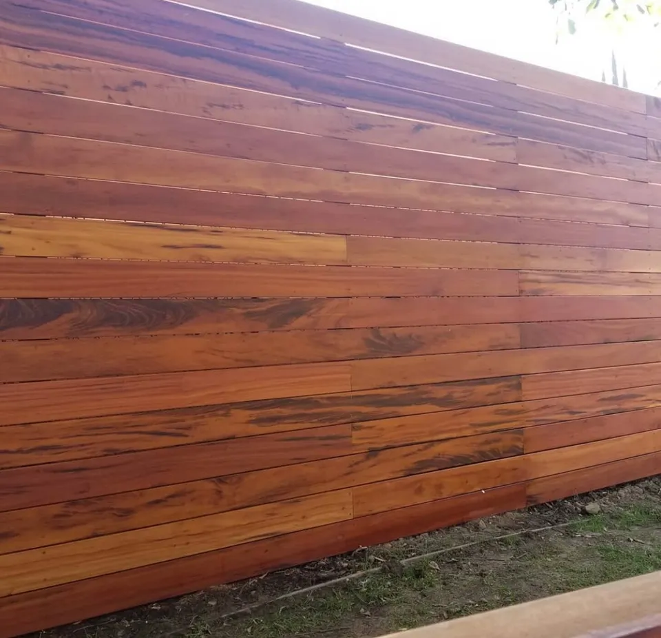 Close view of solid horizontal wood fencing with contrasting natural board tones