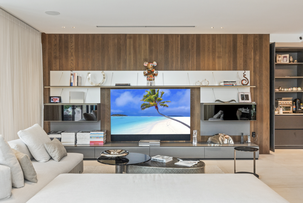 living room with and thermally modified wood species installed accent wall