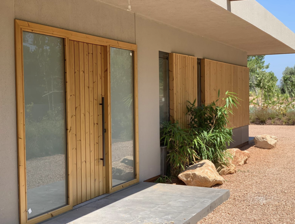 home installed with exterior thermally modified siding and window accents