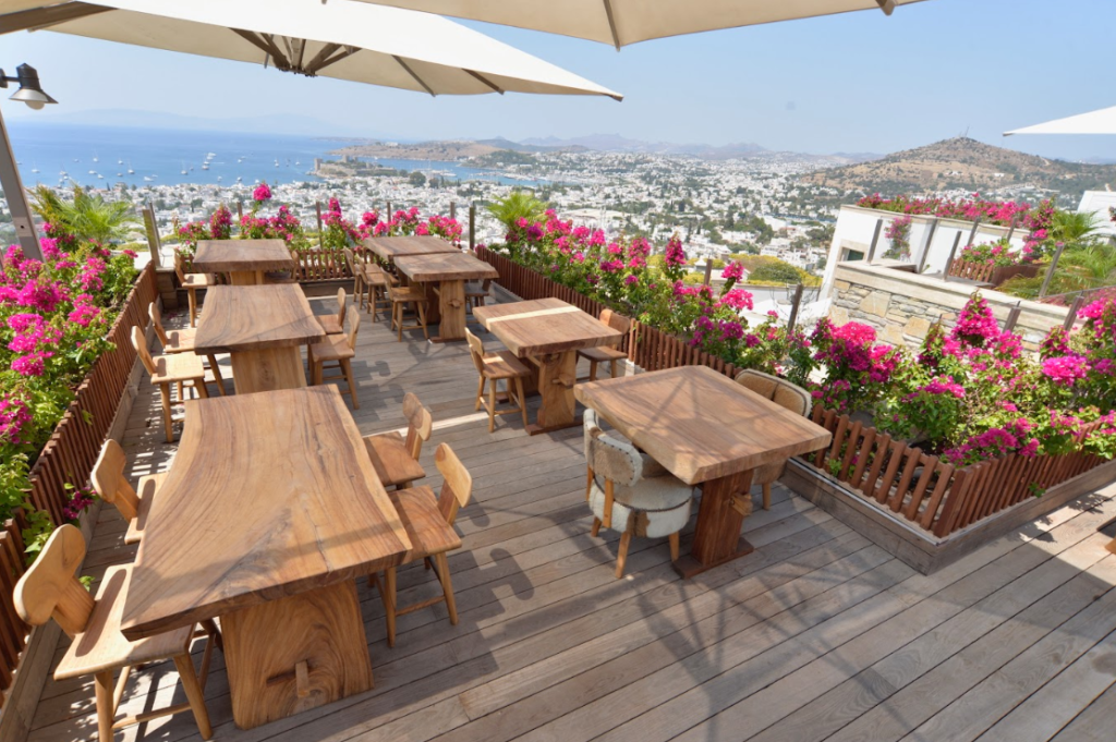 A stunning wood-clad restaurant deck overlooking the coastline.